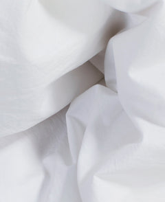 Close-up of Geismars white stone-washed cotton fabric